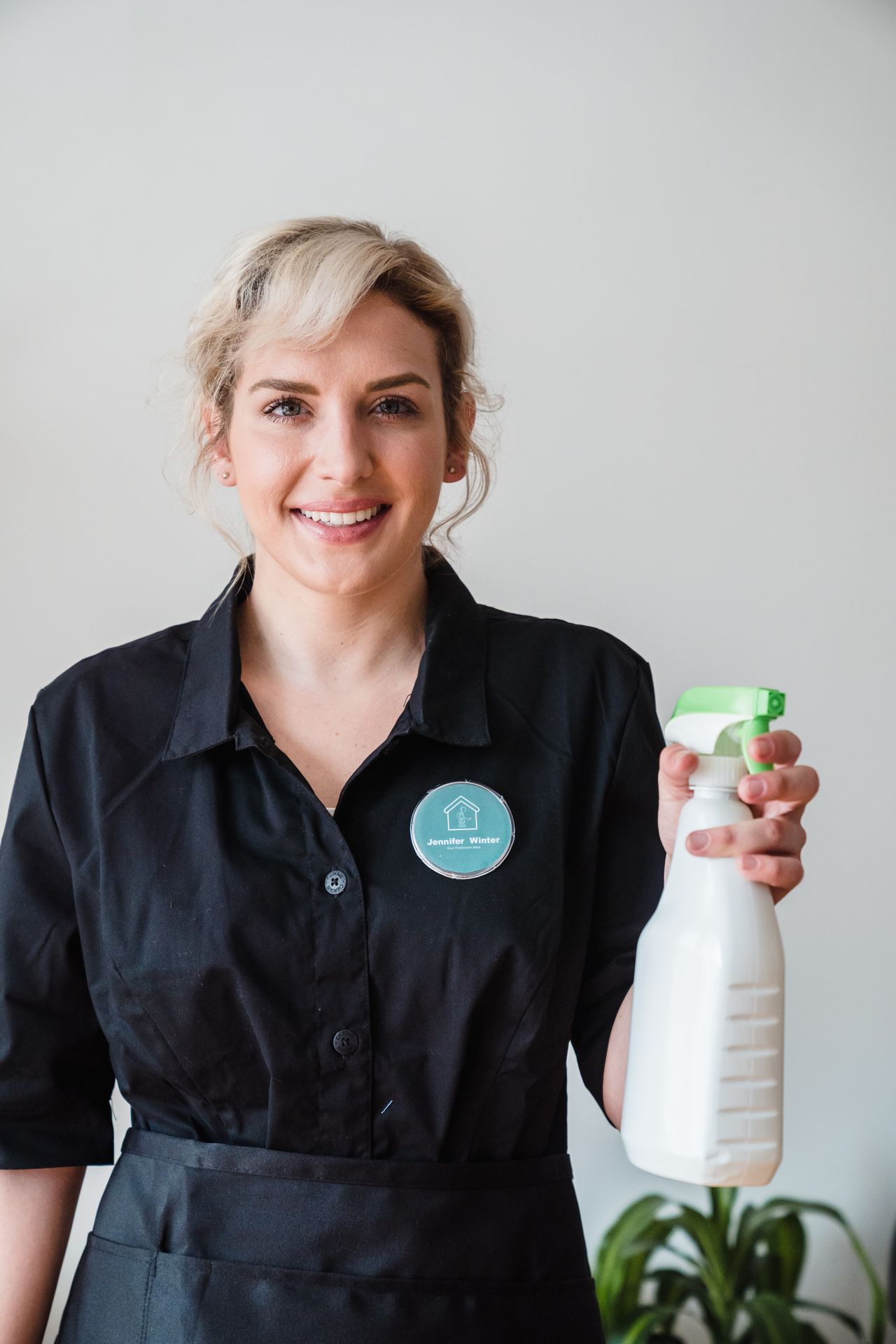 Smiling professional cleaner ready to help
